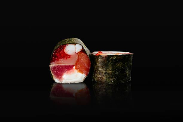Japanese sushi rolls on a black background