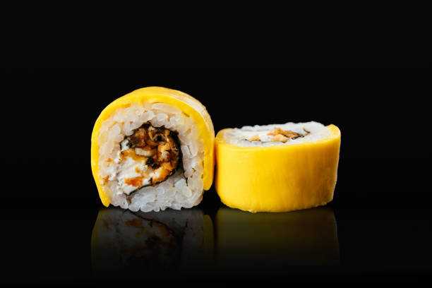 Japanese sushi rolls on a black background