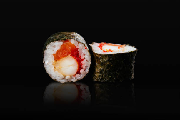 Japanese sushi rolls on a black background