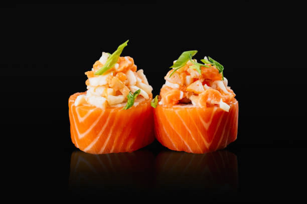 Japanese sushi rolls on a black background