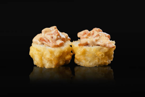 Japanese sushi rolls on a black background