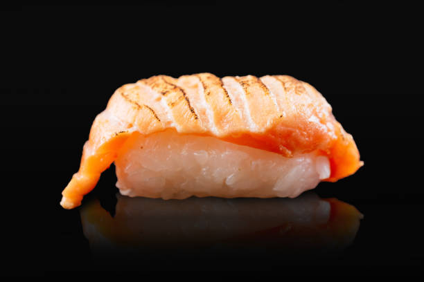 Japanese sushi rolls on a black background