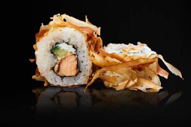 Japanese sushi rolls on a black background