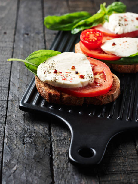 istock Open caprese sandwiches. 1291980838
