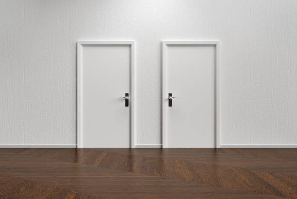 White wall with two closed doors and wooden floor stock photo