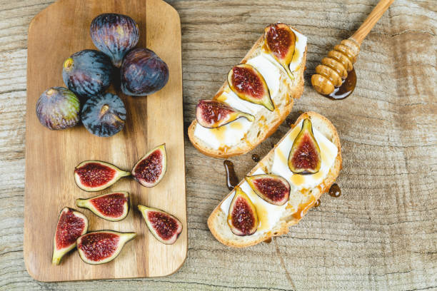 istock Figs with fresh cheese on toast Copy space. 1291981099
