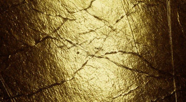 istock Grunge gold foil texture background with cracks and scratches 1291981935