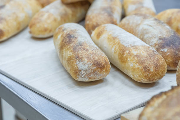 istock Ciabatta bread on the table. Making craft bread at the bakery 1291982093