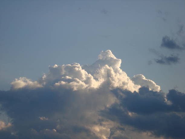 istock Various cumulus clouds in the sky above the village 1291982657