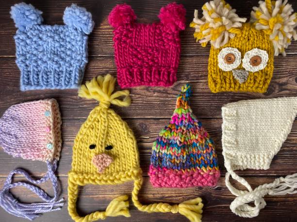istock Colourful hand knit newborn baby hats 1291983679