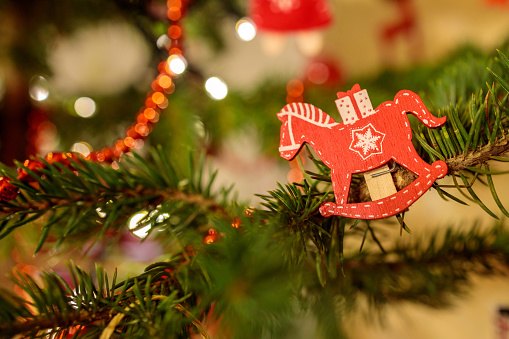 Wooden horse decoration on a Christmas tree.