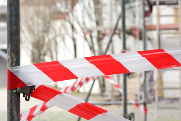 istock On a construction site, a red and white plastic barrier tape hangs on a scaffold 1291987414