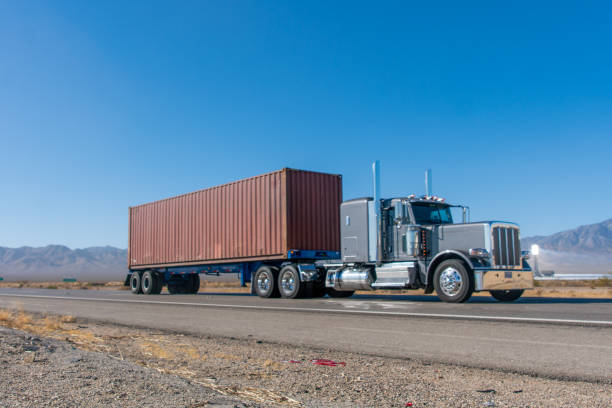 istock Long Haul Semi Truck on A Two Way Highway 1291987622