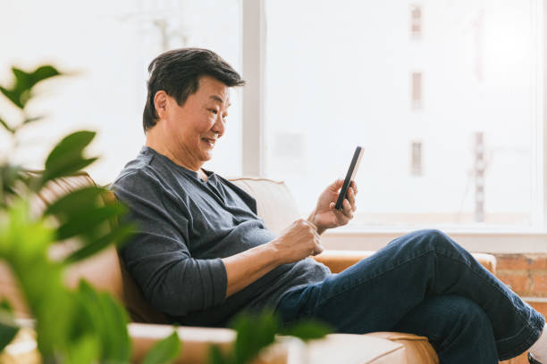 istock Profile view senior man smiling for selfie 1291988899