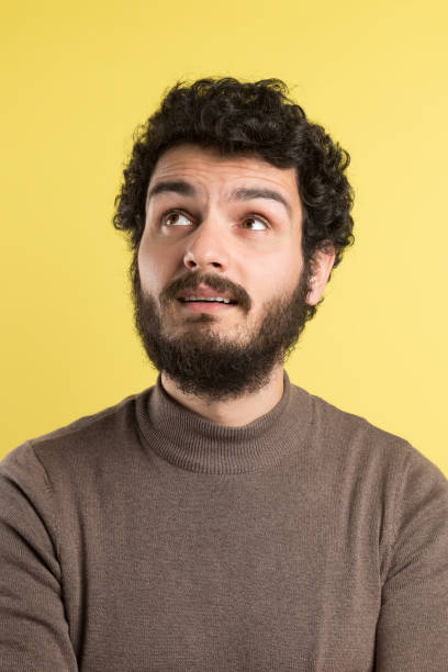 istock Portrait of handsome man looking up 1291994024
