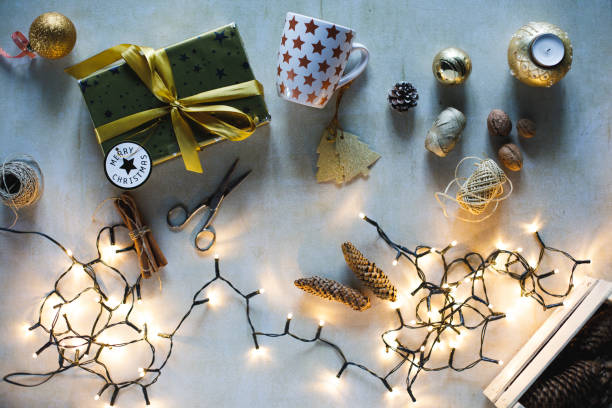 istock Christmas lights, golden present and decorations 1291995184