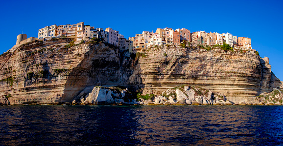 Seaside view from old Town of bonifacio, dramatically siutated atop an eroding limestone promontory. Corsica, France.