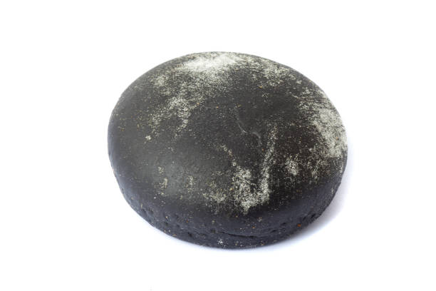 istock black burger bun isolated on white background 1291998415