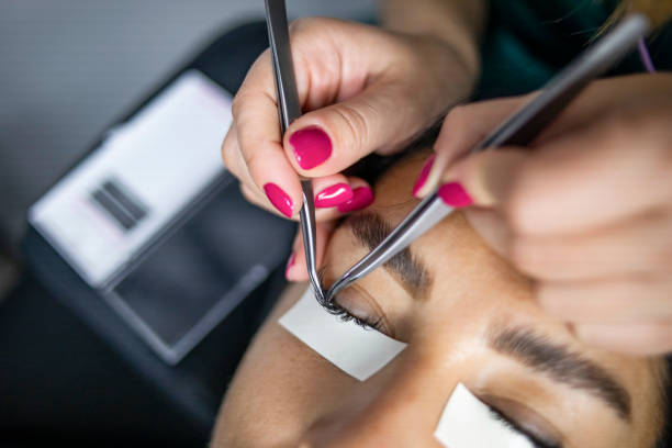 istock Female eye with long lashes. Eyelash extension procedure. Eyelashes, close-up, macro, selective focus 1292001382