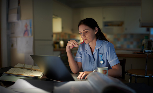 medical student burning the midnight oil after a long shift