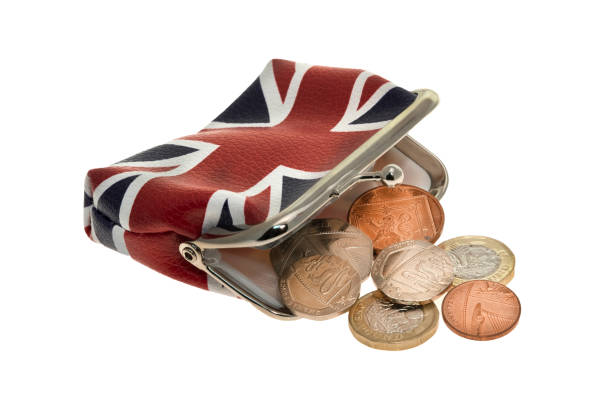 uk union jack flag printed change purse  with coins spilling out - european union coin european union currency coin isolated objects imagens e fotografias de stock