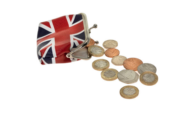 uk union jack flag printed change purse  with coins spilling out - european union coin european union currency coin isolated objects imagens e fotografias de stock