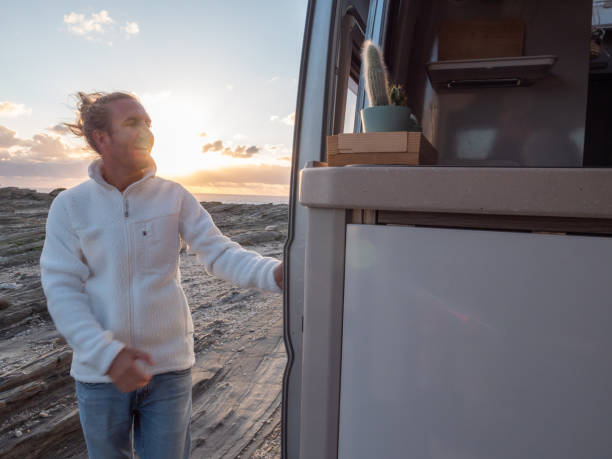istock Man sets his van on the Sardinia coastline 1292006559