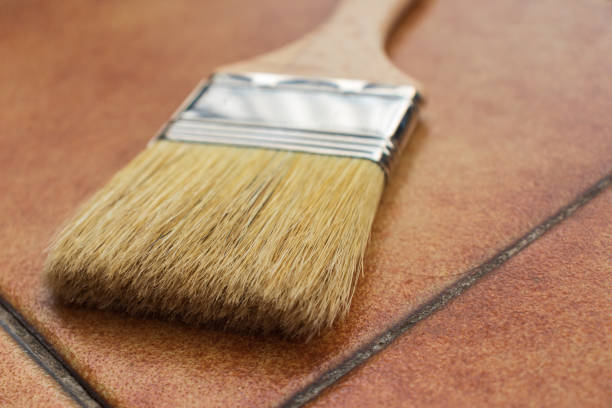 istock A paint brush on a terracotta floor 1292006670
