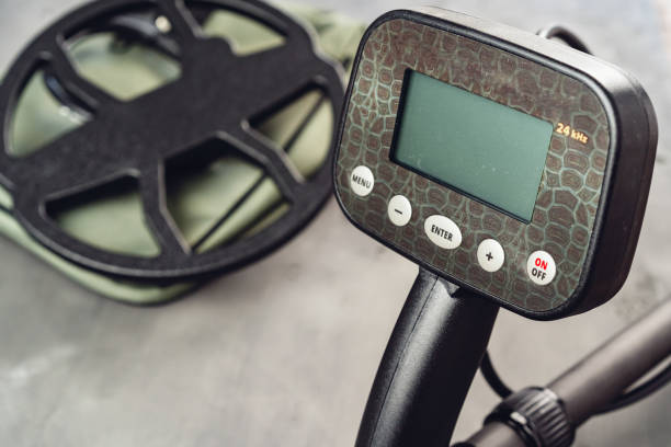 istock Metal detector tool on concrete background close up 1292015840