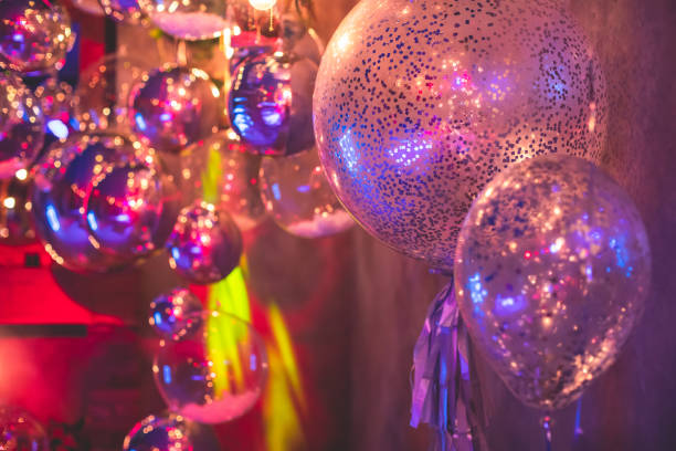 istock Decoration interior elements of restaurant venue banquet hall with multicoloured different helium balloons, on a indoor corporate event or wedding reception or birthday party celebration 1292018757