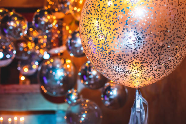 istock Decoration interior elements of restaurant venue banquet hall with multicoloured different helium balloons, on a indoor corporate event or wedding reception or birthday party celebration 1292018765