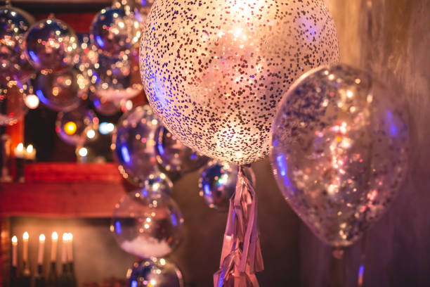 istock Decoration interior elements of restaurant venue banquet hall with multicoloured different helium balloons, on a indoor corporate event or wedding reception or birthday party celebration 1292018772