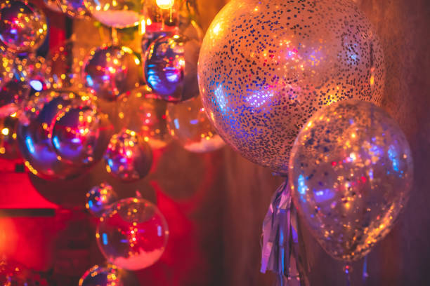 istock Decoration interior elements of restaurant venue banquet hall with multicoloured different helium balloons, on a indoor corporate event or wedding reception or birthday party celebration 1292018785
