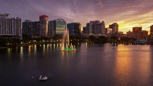 istock Colorful Sunset Behind Orlando Skyline and Lake Eola 1292021489