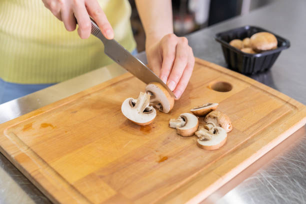 young asian woman cooks in a kitchen,hands,Vegetables,