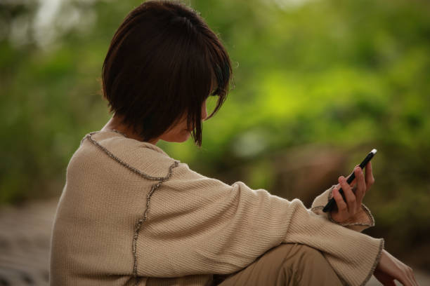 istock A woman who is depressed looking at a smartphone 1292028281