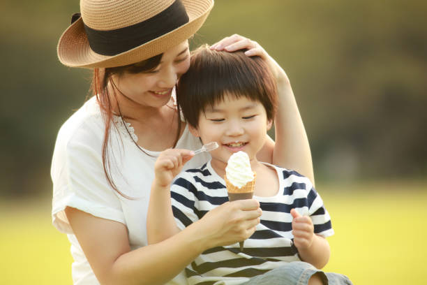 istock Parents and children eating soft serve ice cream 1292029795