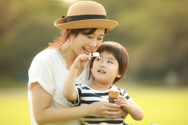 istock Parents and children eating soft serve ice cream 1292029821