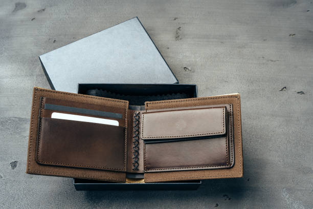 istock New brown leather wallet on dark background 1292031436