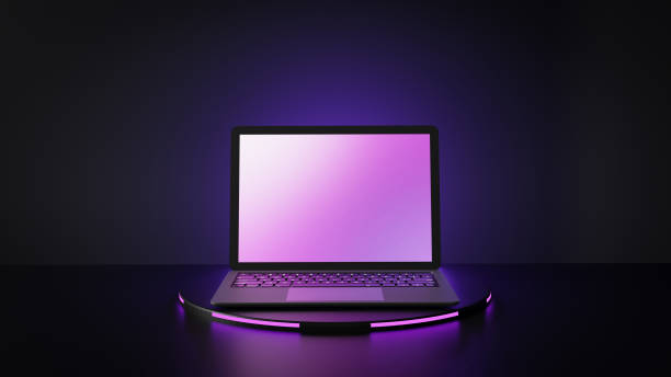 istock Laptop computer with blank purple screen placed on circle stand and blue lighting background. 1292032437