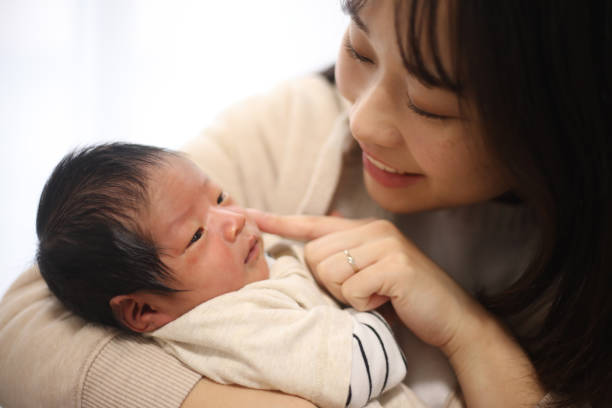 istock Newborn and mother 1292032526