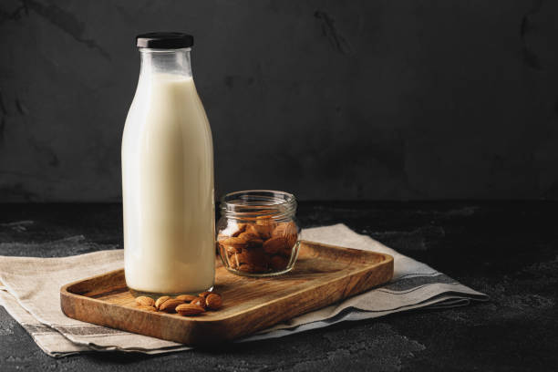 istock Almond milk with almond nuts in glass 1292032588