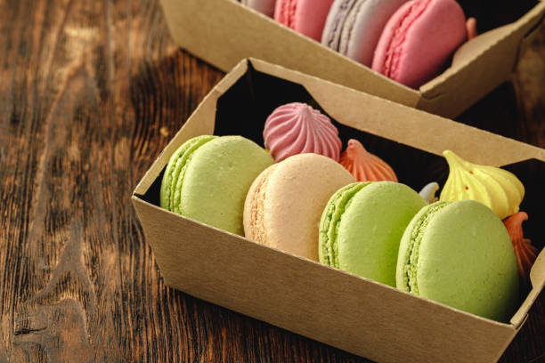 istock Colorful macaron cookies in a cardboard box 1292035693