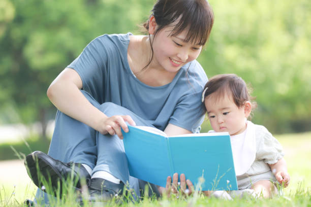 istock Parents and children reading books 1292037501