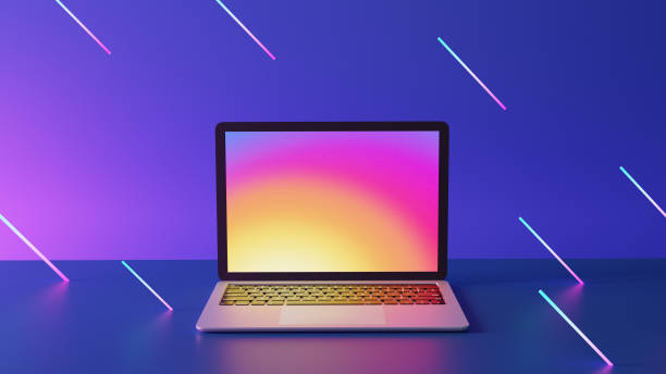 istock Laptop computer with blank purple screen placed on circle stand and blue lighting background. 1292038824