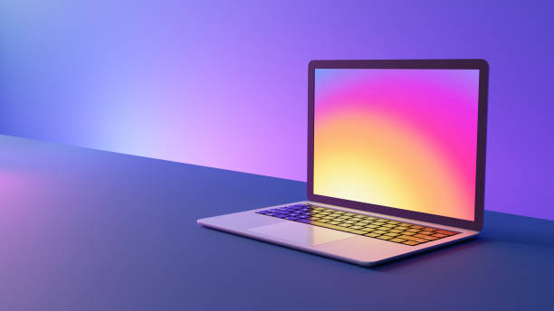 istock Laptop computer with blank purple screen placed on circle stand and blue lighting background. 1292038831