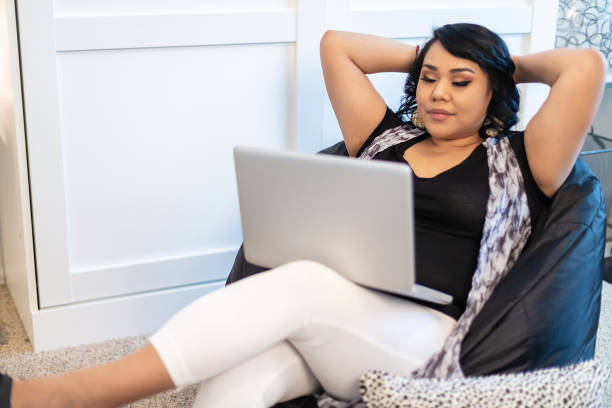 istock Native American Generation Z Female Using Technology Working From Home During Pandemic Photo Series 1292043324