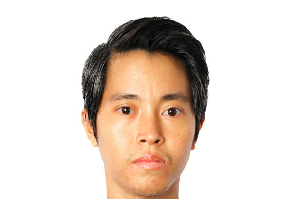 istock Closeup of face young Asian man on white background. 1292049043
