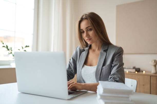 istock Beauitul young woman working using computer laptop concentrated 1292052493