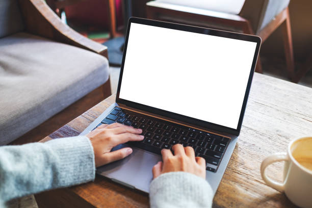 istock a woman using and typing on laptop computer keyboard with blank white desktop screen 1292057097